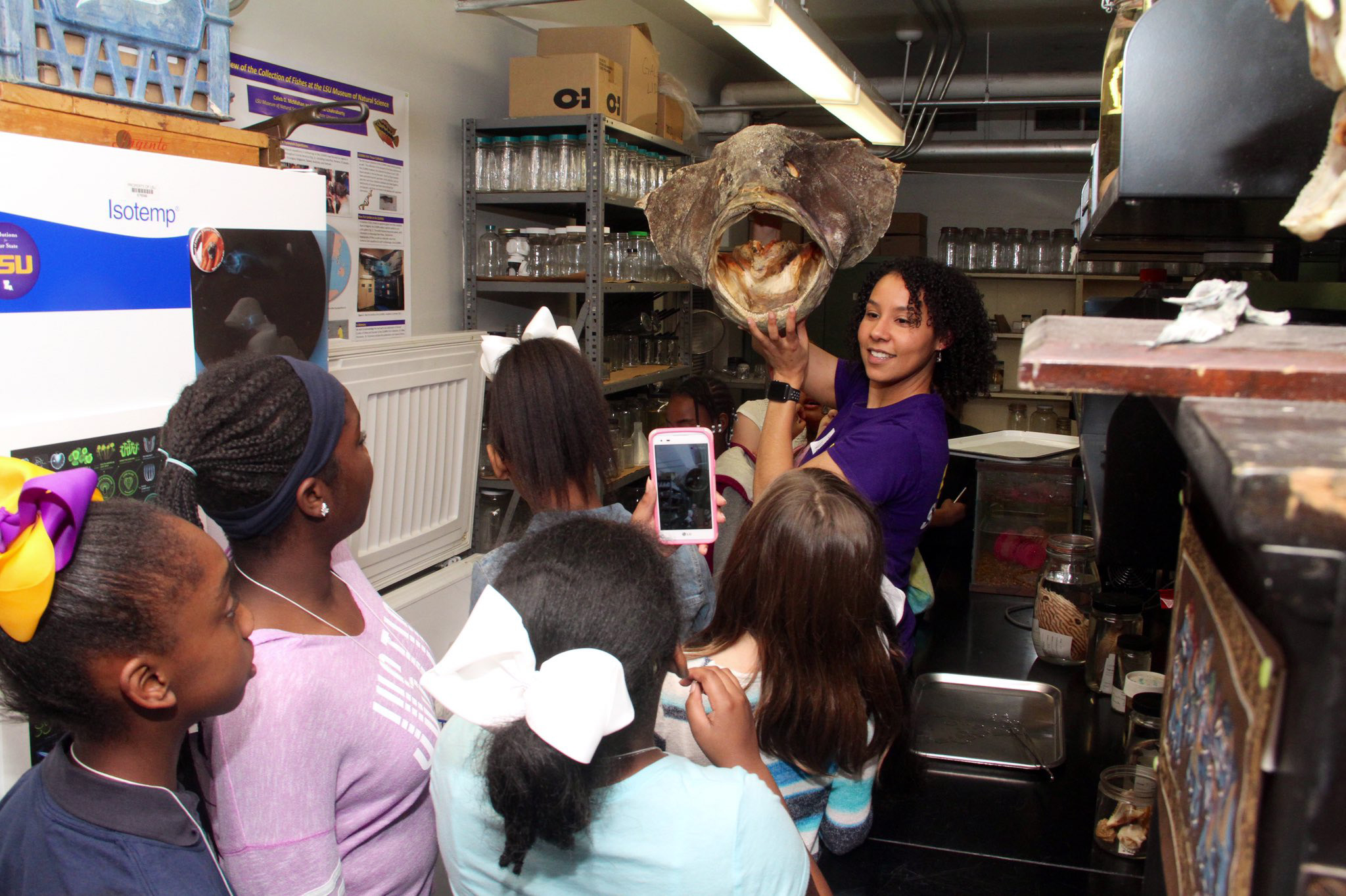 Valerie Derouen holds specimen in the LSU Museum of Natural Science for children to examine