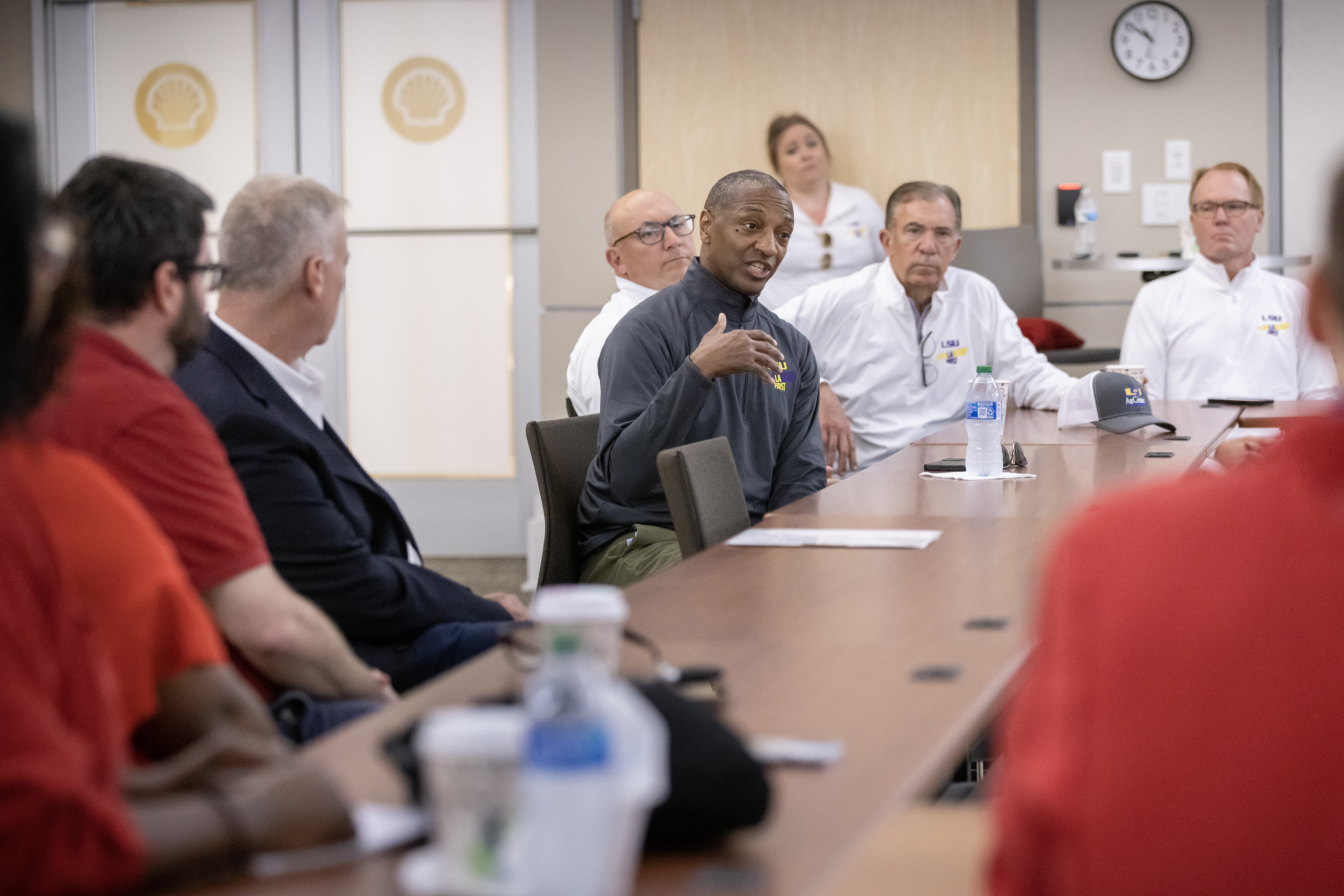 President Tate speaks with Shell personnel in Convent 