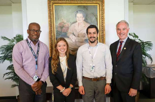 Liz Heintz in group photo with Drs. Robert Newton Jr., Terrence Riley, and John Kirwan at Pennington Biomedical Research Center.