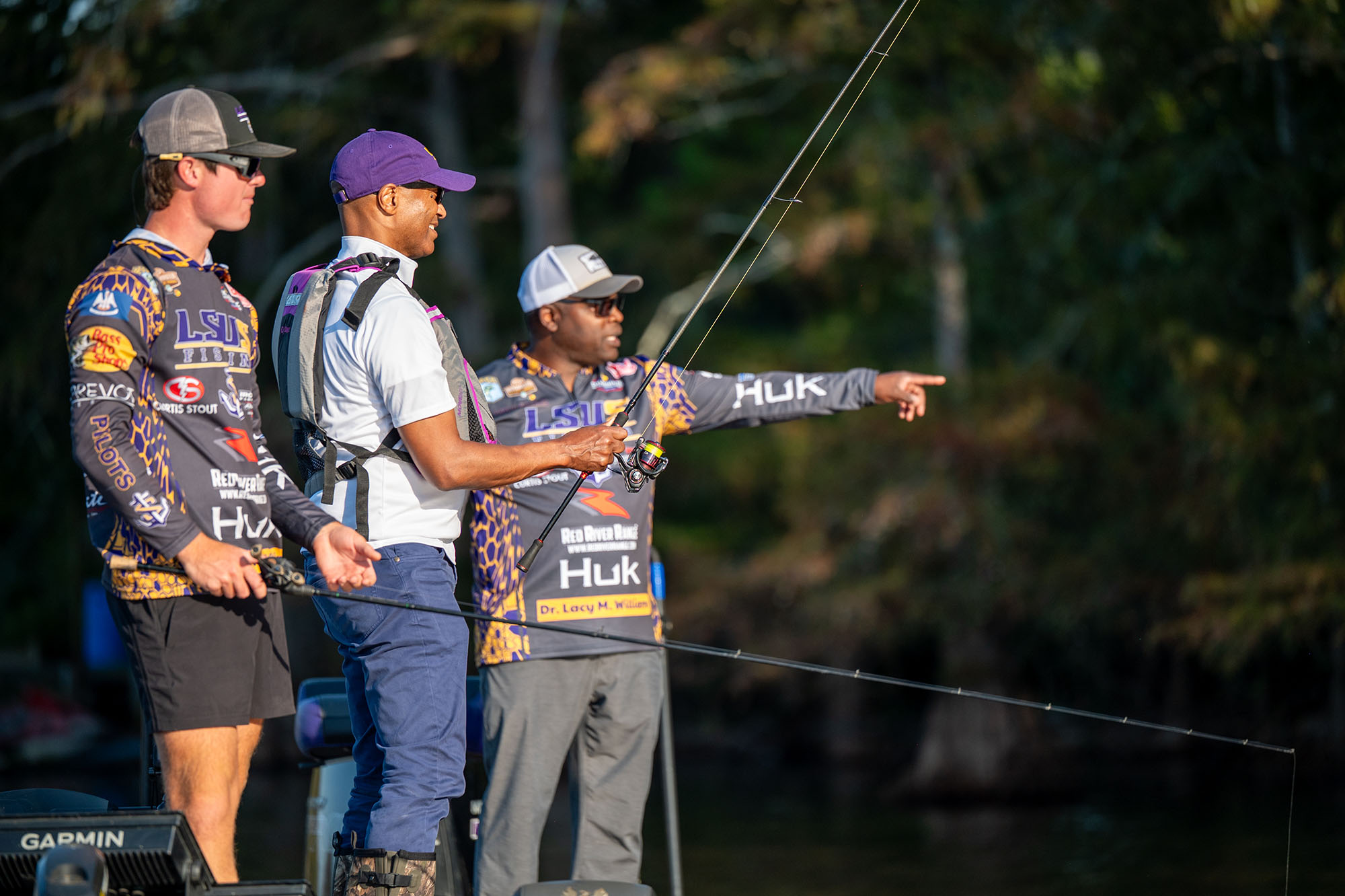 President Tate and students fishing in boat