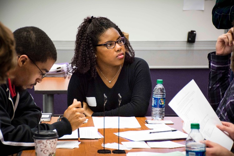 People sitting around a table for a tutoring session