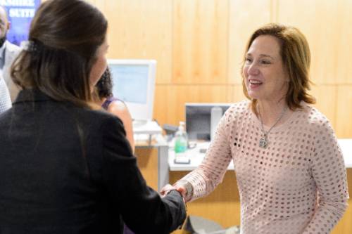 two ladies shaking hands