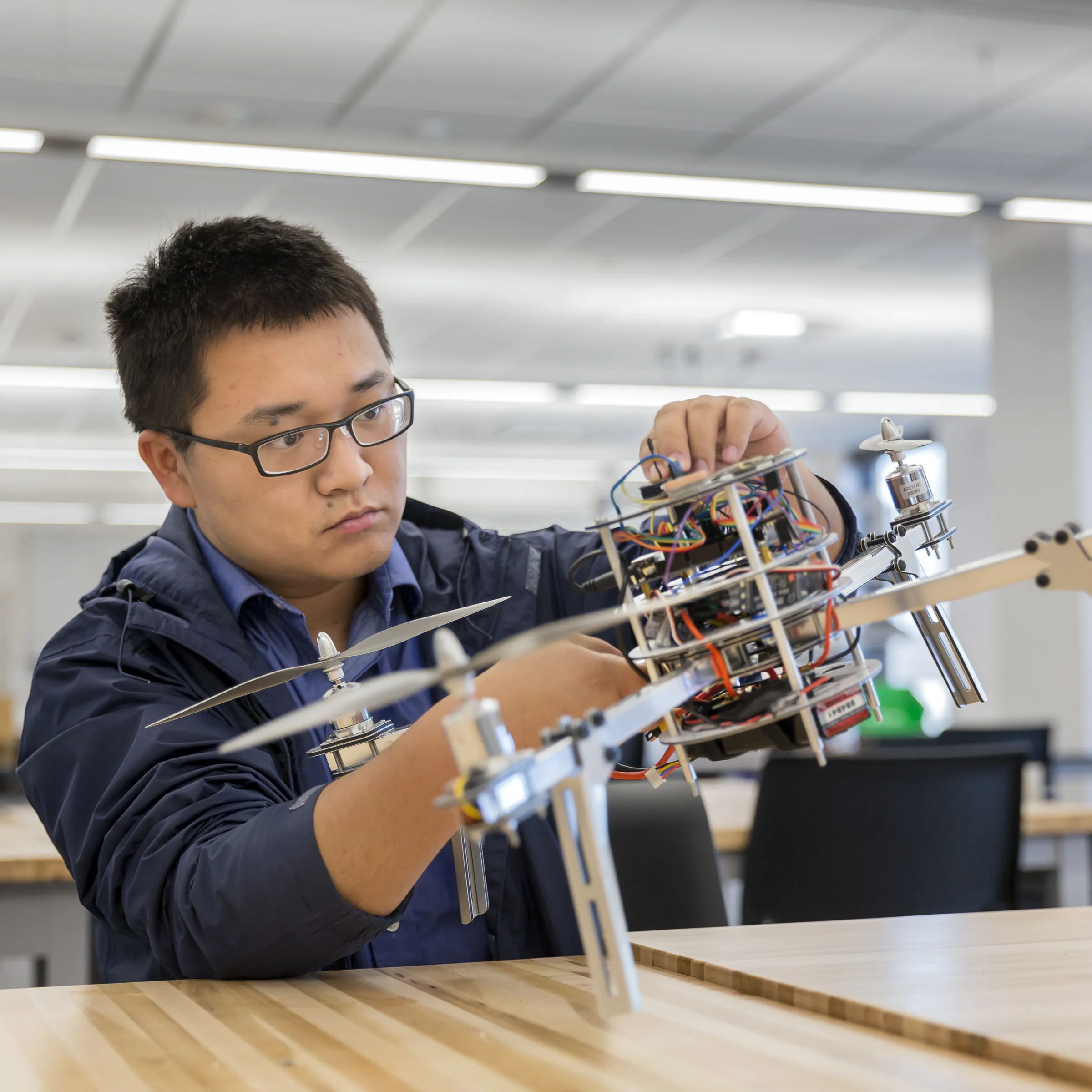 Student working on flying drone