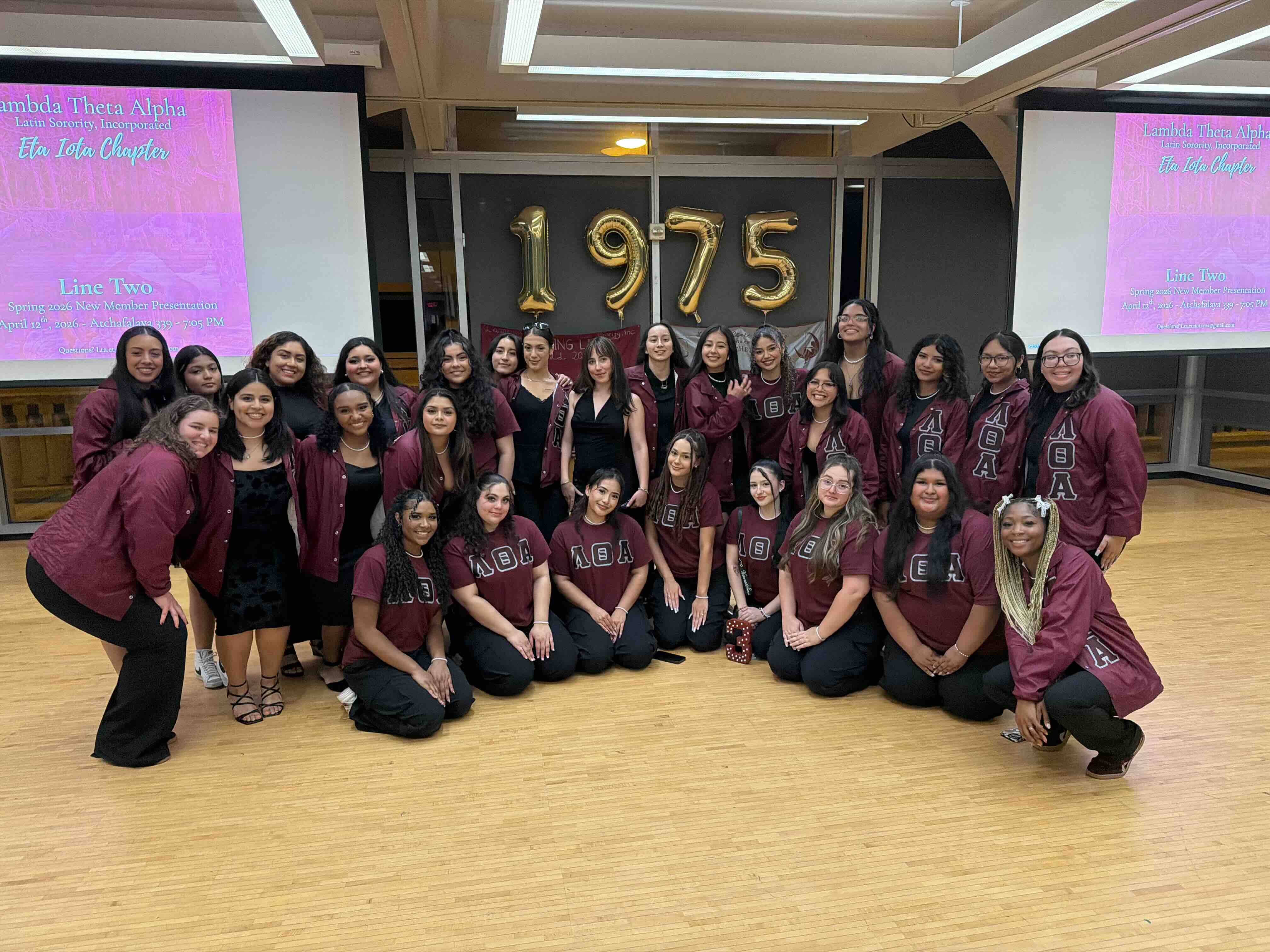 lambda theta alpha members pose in a group in the LSU Student Union