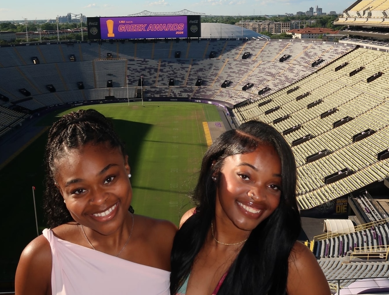 women of AKA pose in stadium