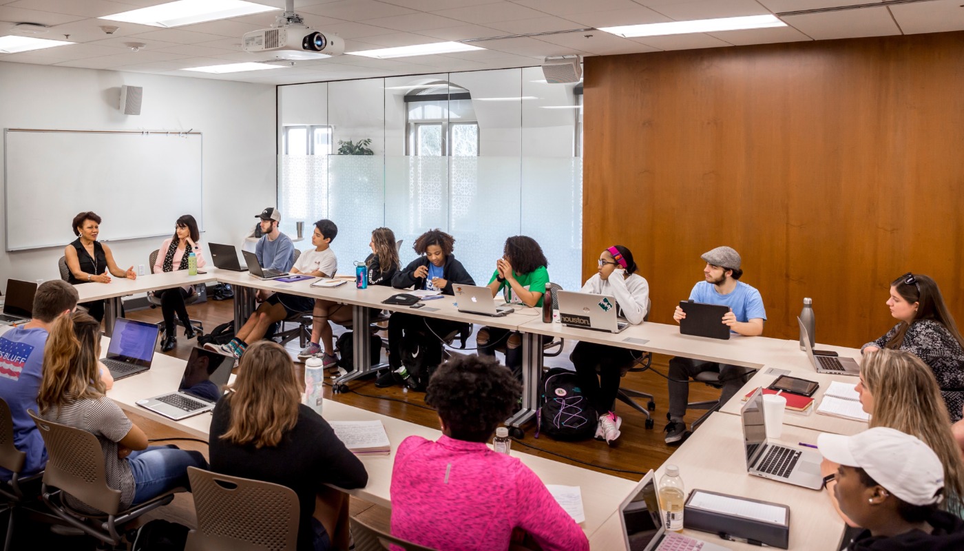A photo of a seminar being held in a classroom inside the French House
