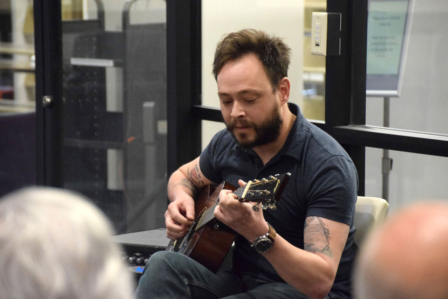 Charlie Rauh performs guitar